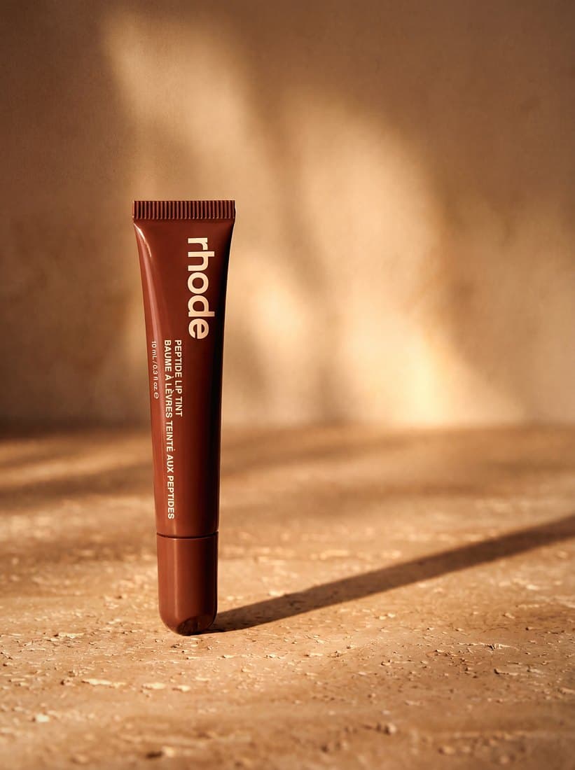 Lip tint editorial macro with glossy swatch