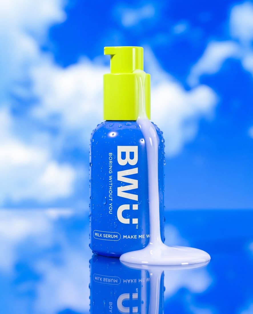Skincare tube hero on a bold colour-blocked set, high-key studio lighting